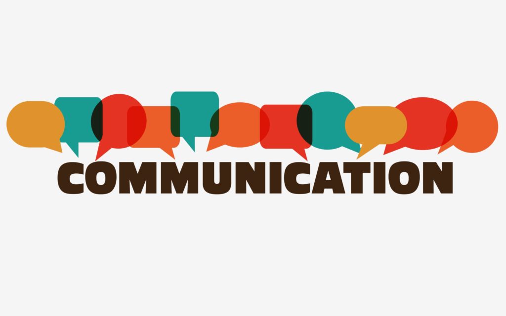 'Communication’ in bold lettering surrounded by word bubbles.