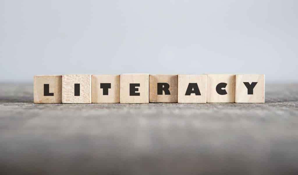 ‘Literacy’ spelled out in wooden blocks.
